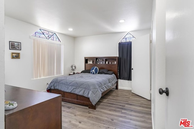 bedroom with light hardwood / wood-style floors