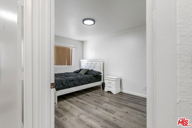 bedroom with light wood-type flooring