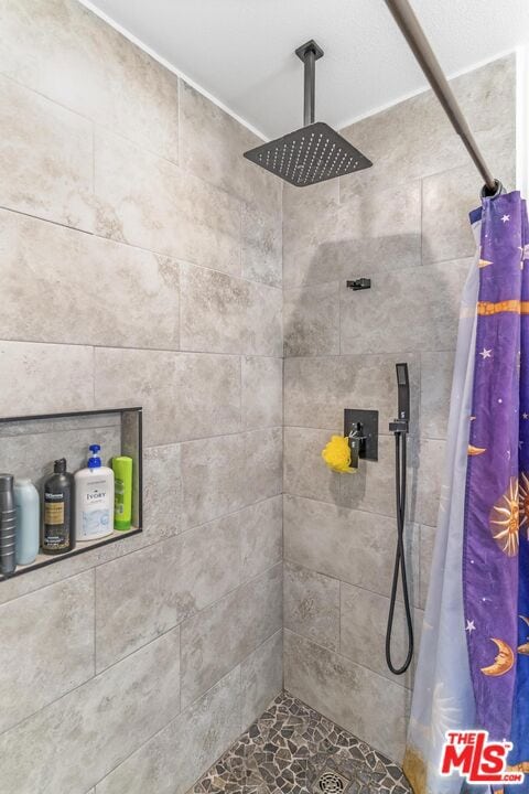 bathroom with curtained shower