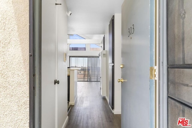 corridor with dark wood-type flooring