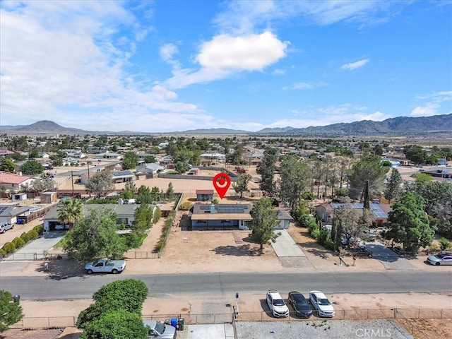 birds eye view of property featuring a mountain view