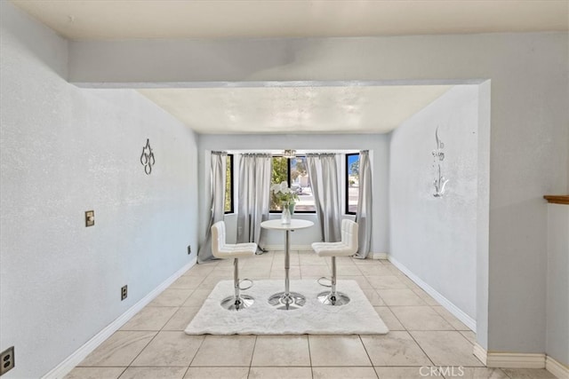 interior space with light tile patterned floors