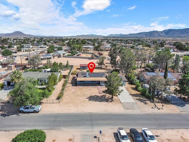 birds eye view of property featuring a mountain view