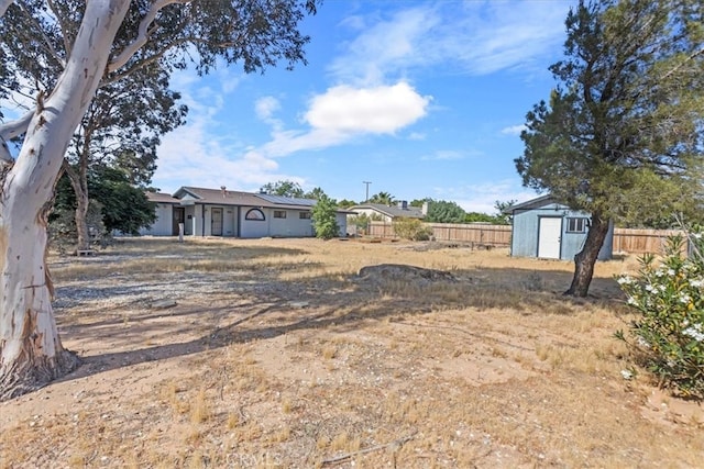 view of yard featuring a storage unit