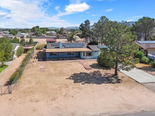 birds eye view of property featuring a mountain view