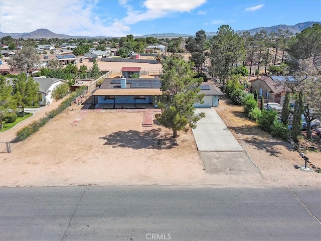 birds eye view of property featuring a mountain view