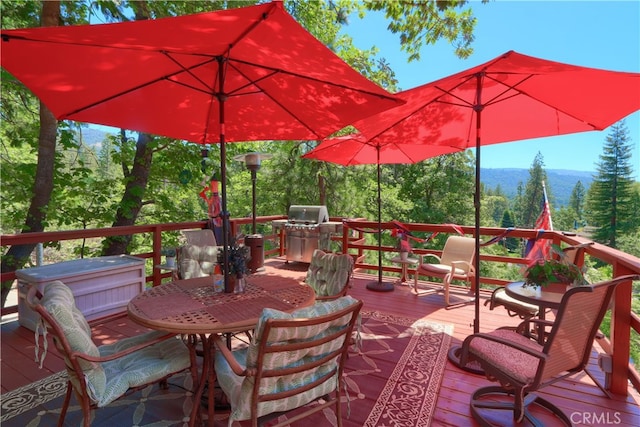 exterior space featuring exterior kitchen and a mountain view