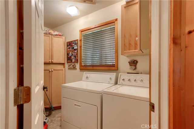 laundry area featuring cabinets and independent washer and dryer