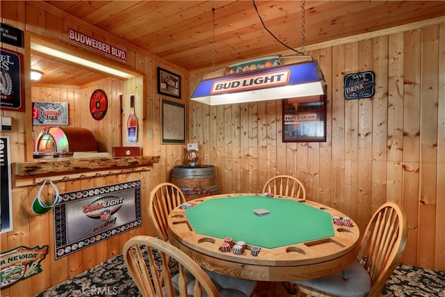 game room with wood walls and wooden ceiling