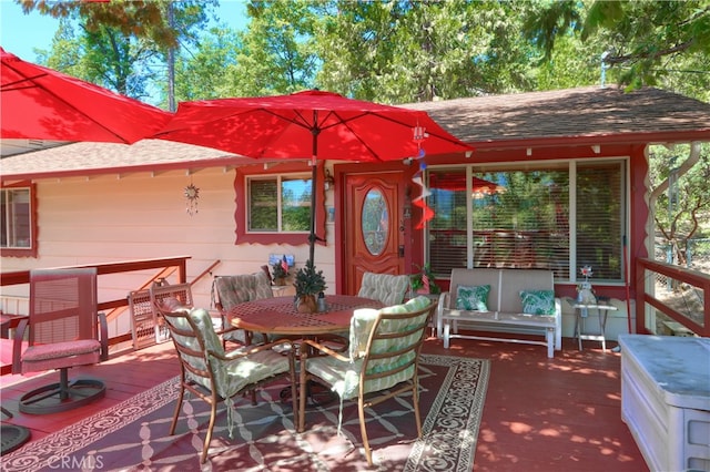 exterior space featuring outdoor lounge area and a wooden deck