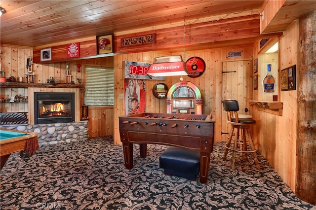 recreation room with carpet, pool table, wooden ceiling, and wooden walls