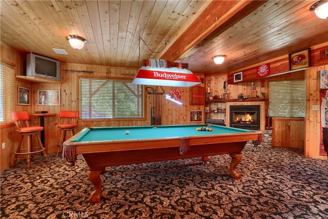 game room with beam ceiling, wood ceiling, and wood walls