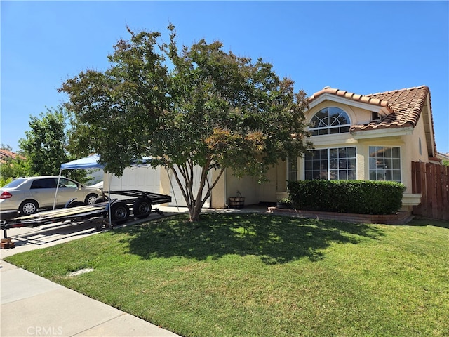 view of front of property with a front lawn