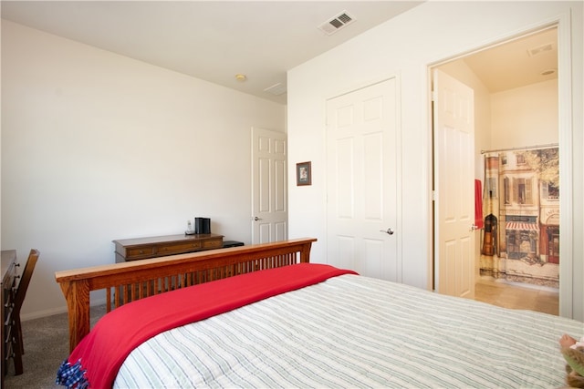 carpeted bedroom featuring a closet