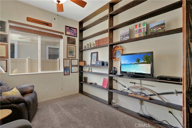 interior space with light carpet and ceiling fan