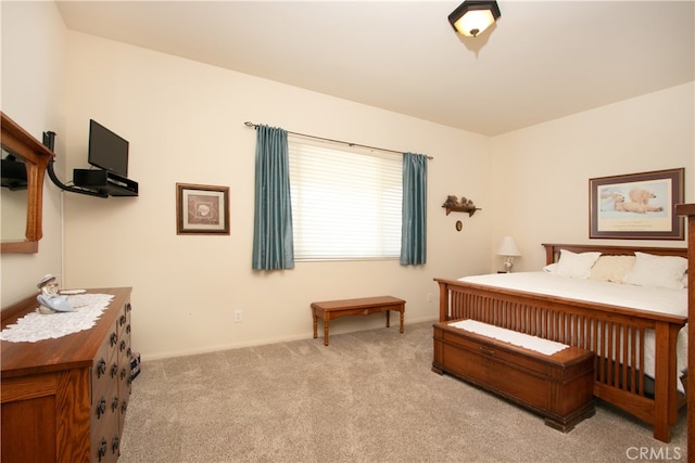 bedroom with light colored carpet