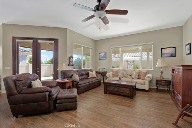 living room with french doors, ceiling fan, hardwood / wood-style flooring, and plenty of natural light