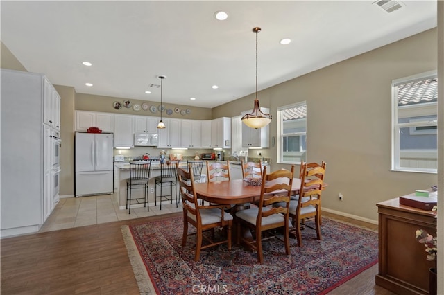 dining room with light hardwood / wood-style floors