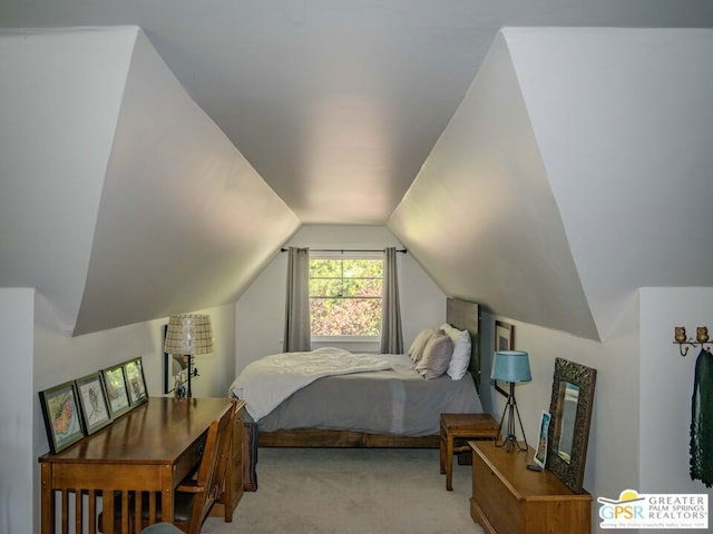 bedroom featuring lofted ceiling and light carpet