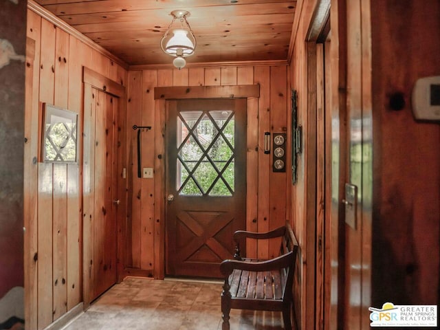 doorway with wooden walls and wooden ceiling