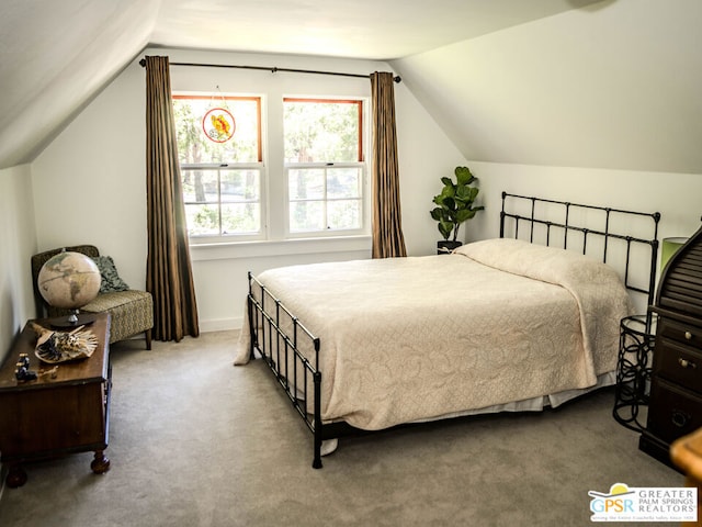 bedroom featuring carpet flooring and vaulted ceiling