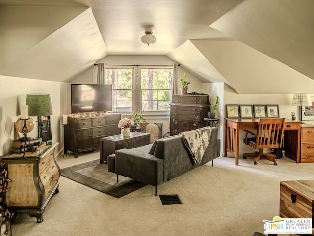 interior space featuring lofted ceiling and light colored carpet