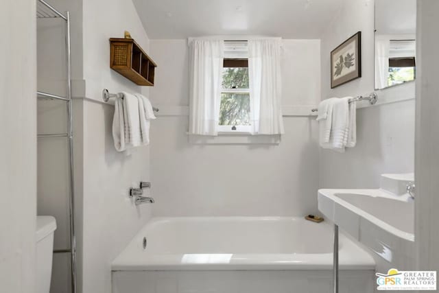 bathroom with toilet and separate shower and tub