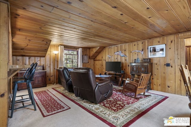 living room with light carpet, wood ceiling, and wood walls