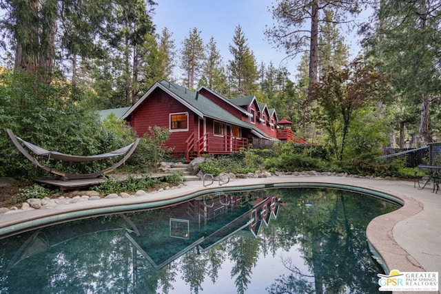 view of swimming pool featuring a patio