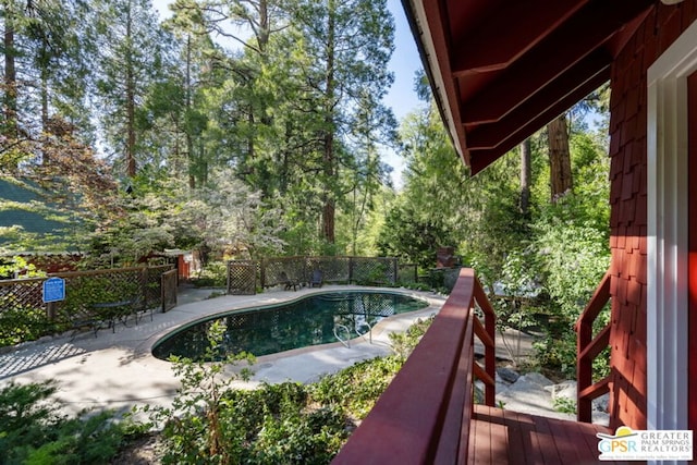 view of swimming pool with a patio