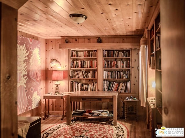 living area featuring wood ceiling, hardwood / wood-style flooring, wooden walls, and built in shelves