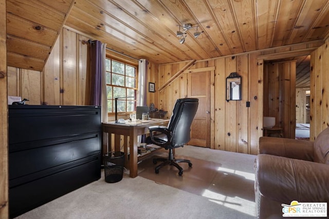 carpeted office space with wood walls and wooden ceiling