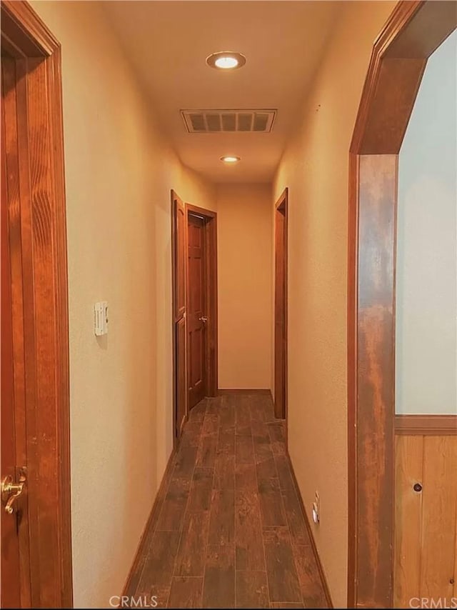 hallway with dark hardwood / wood-style floors