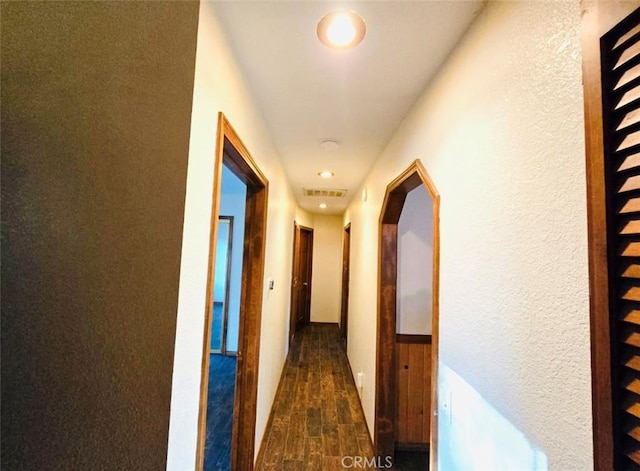 corridor featuring dark hardwood / wood-style flooring