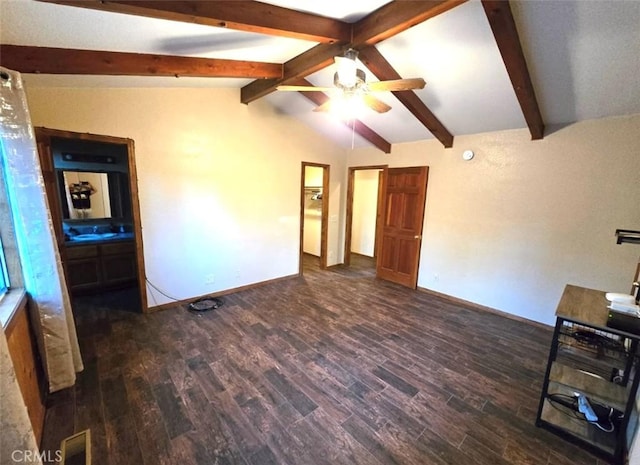 interior space featuring lofted ceiling with beams and dark hardwood / wood-style floors