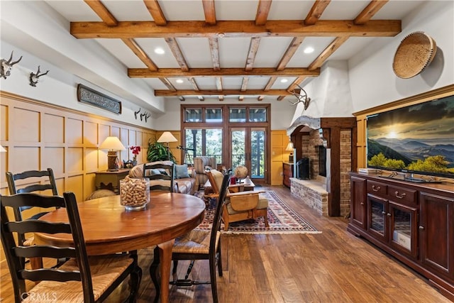 28964 Quail Run Ct, Lake Arrowhead, CA 92352 - dining room featuring beamed ceiling, hardwood / wood-style floors, a fireplace, recessed lighting, and a decorative wall