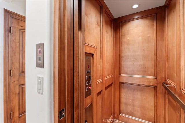 28964 Quail Run Ct, Lake Arrowhead, CA 92352 - elevator featuring recessed lighting and wooden walls