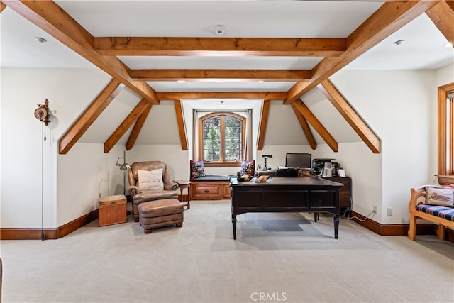 office space with light carpet and vaulted ceiling with beams