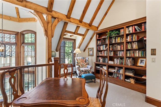 sitting room with beam ceiling, high vaulted ceiling, and carpet