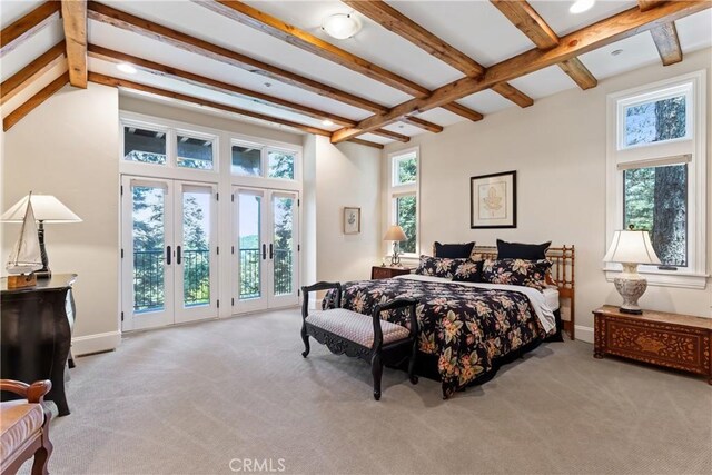 carpeted bedroom featuring multiple windows, french doors, beam ceiling, and access to exterior