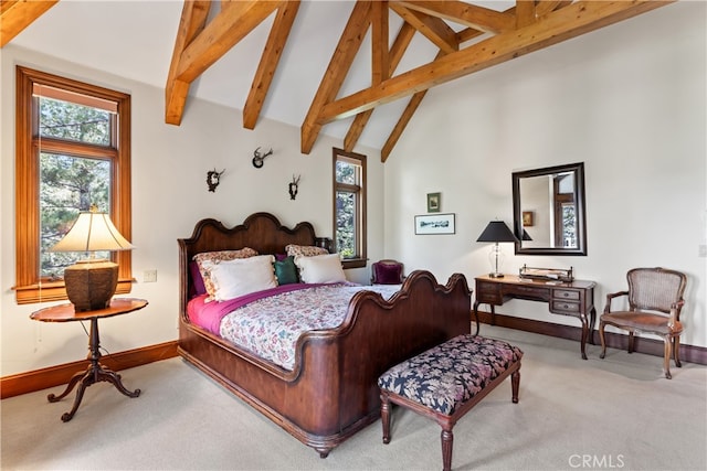 carpeted bedroom with beamed ceiling and high vaulted ceiling