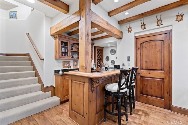 28964 Quail Run Ct, Lake Arrowhead, CA 92352 - indoor wet bar with light wood-style floors, beamed ceiling, recessed lighting, stairway, and baseboards
