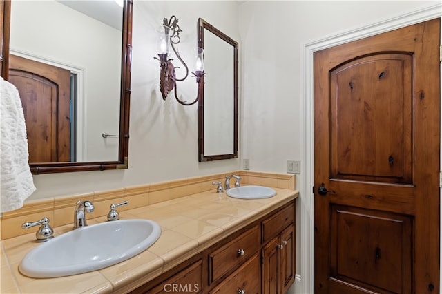 bathroom featuring vanity and decorative backsplash