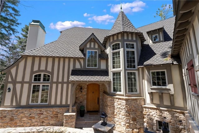 28964 Quail Run Ct, Lake Arrowhead, CA 92352 - view of front facade featuring stucco siding, stone siding, and a chimney