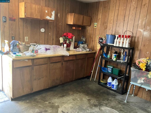 kitchen featuring wooden walls