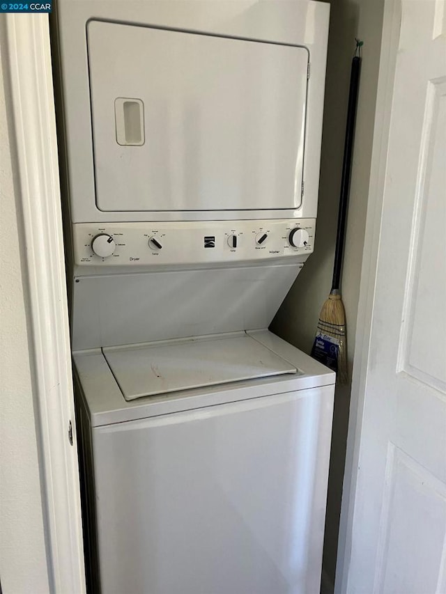 laundry room with stacked washer and clothes dryer