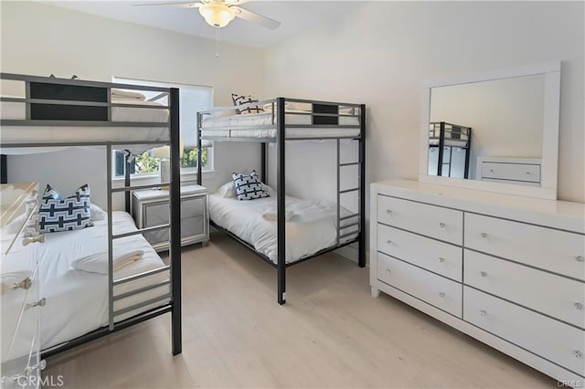 bedroom with ceiling fan and light wood-type flooring