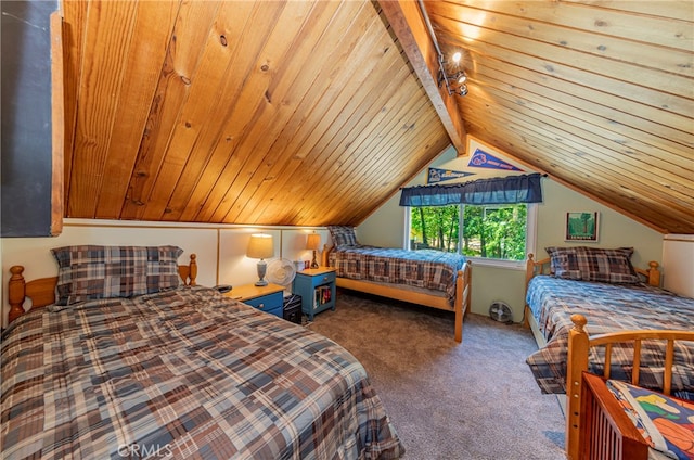 bedroom featuring lofted ceiling with beams, wooden ceiling, and carpet