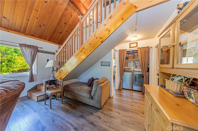 living room featuring vaulted ceiling, hardwood / wood-style flooring, washer and clothes dryer, and wood ceiling