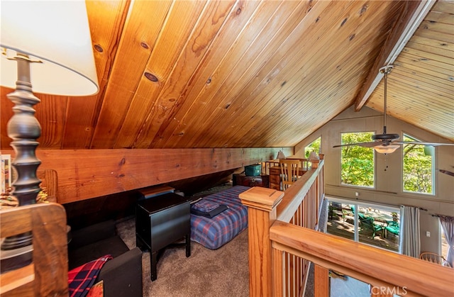 interior space with wood ceiling, wooden walls, carpet, and vaulted ceiling